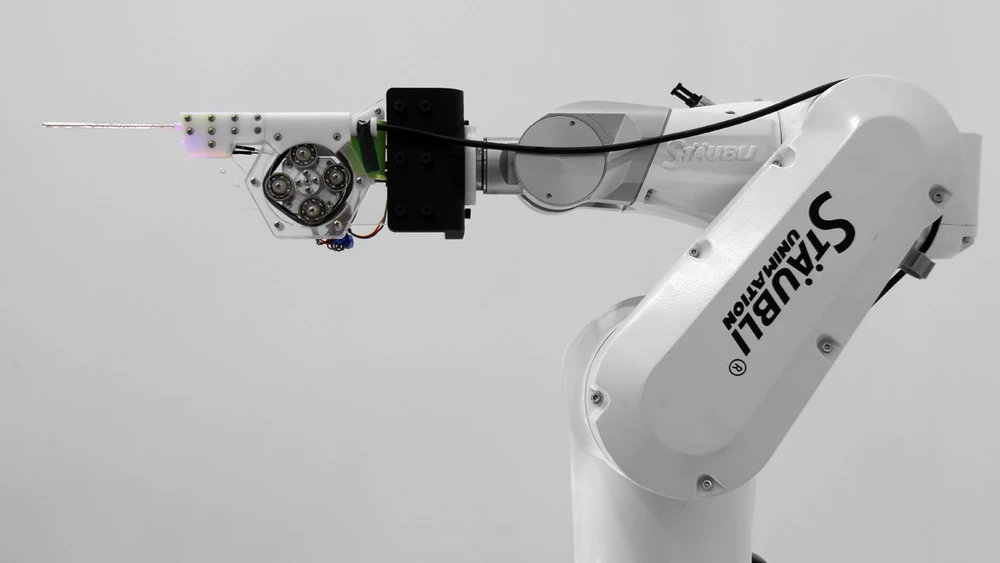 The pump's direction and flow rate are controlled by an Arduino, and the shape of the print is coordinated with the motion of the robot