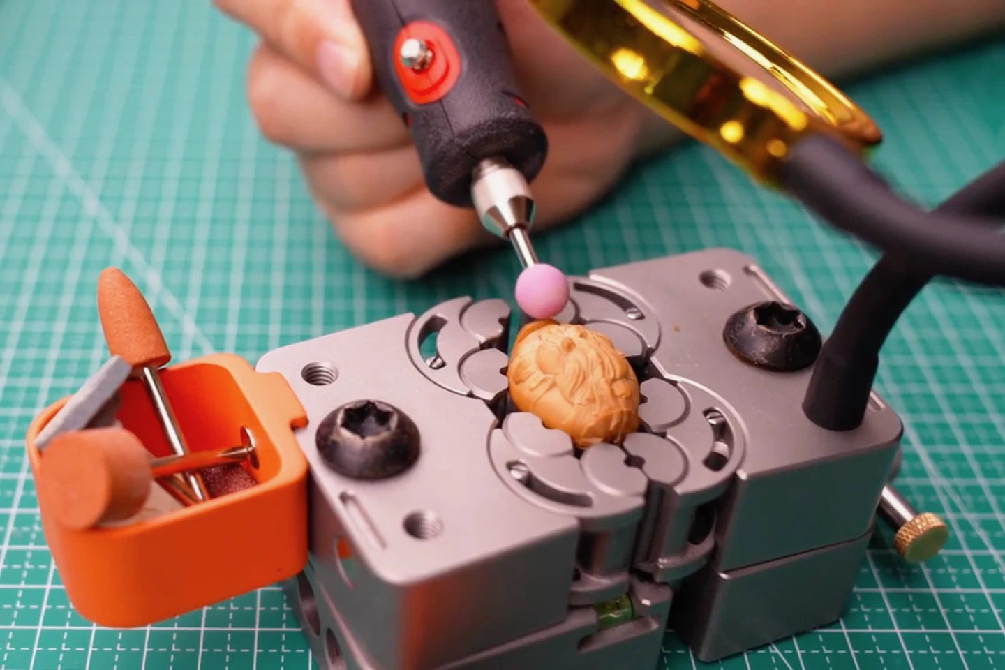 Optional extras include mini parts bins and an adjustable-angle magnifying glass