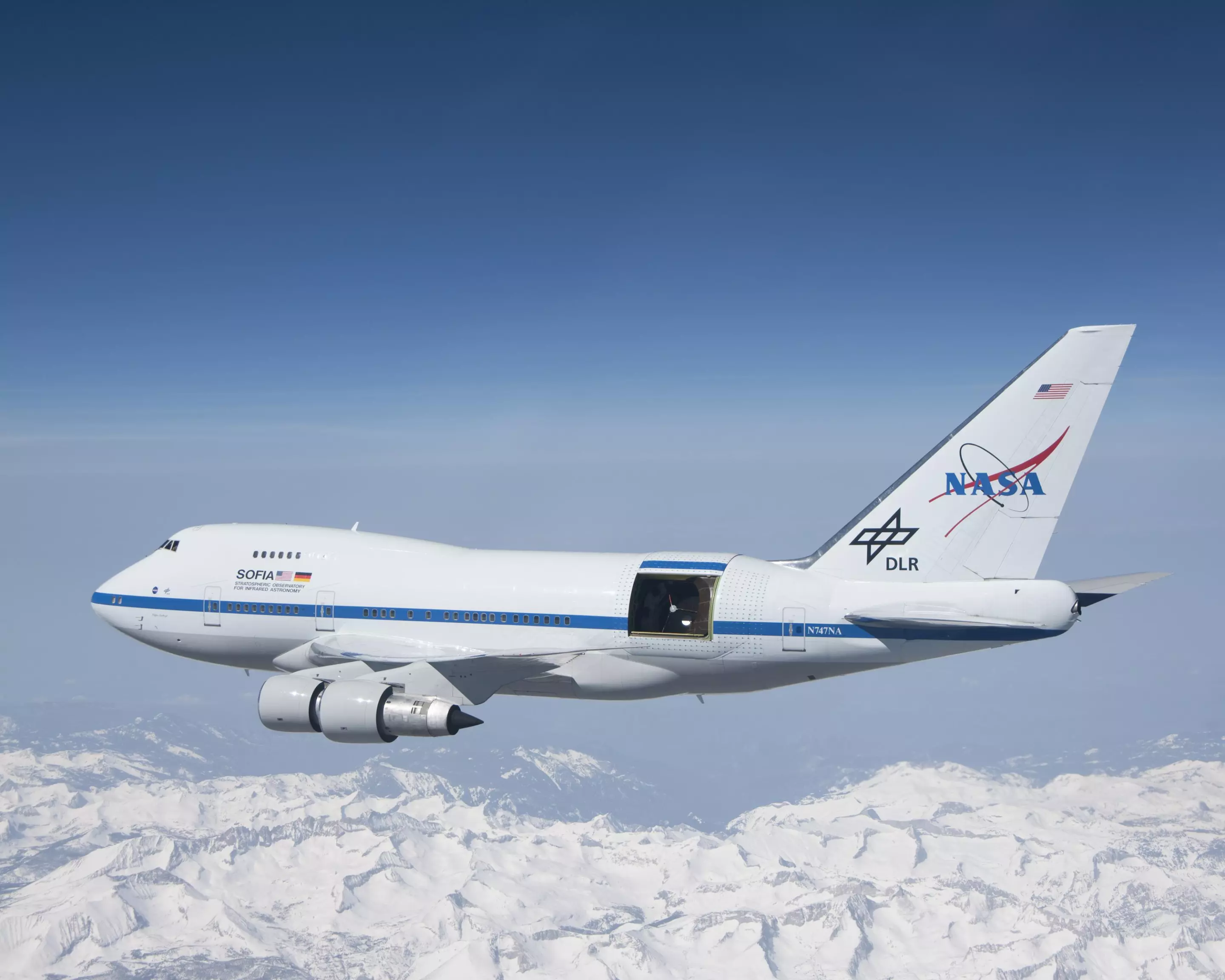 Shot of the SOFIA telescope in flight over the Sierra Nevada mountains