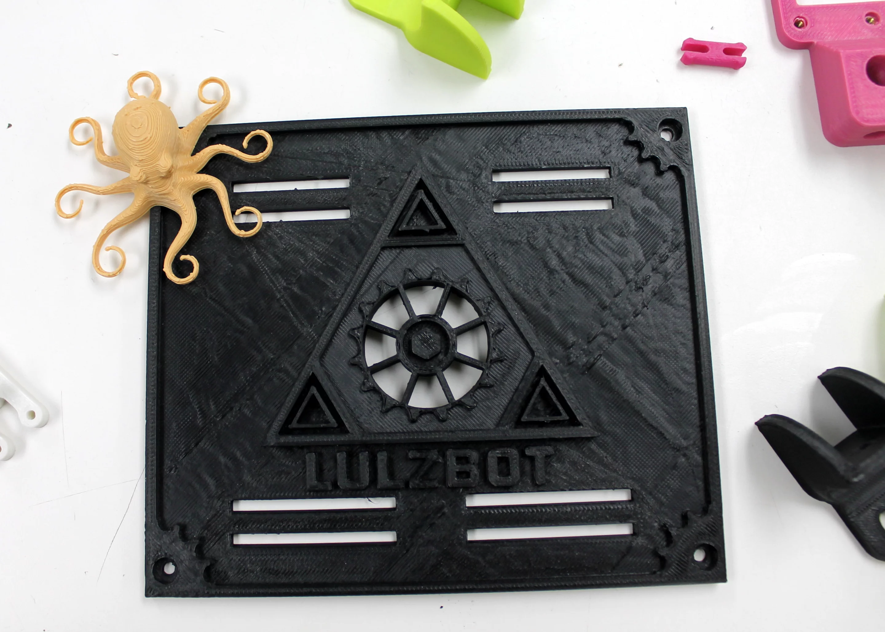 The LulzBot logo, captured in ABS plastic and framed by the company's octopus that arrives with every printer purchase