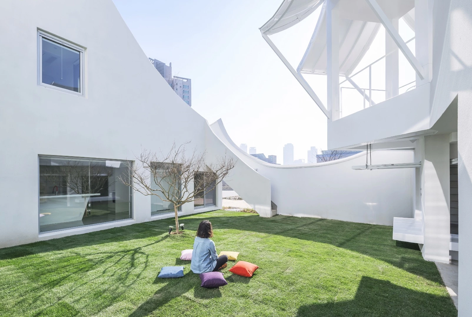 The Flying House is arranged around a courtyard