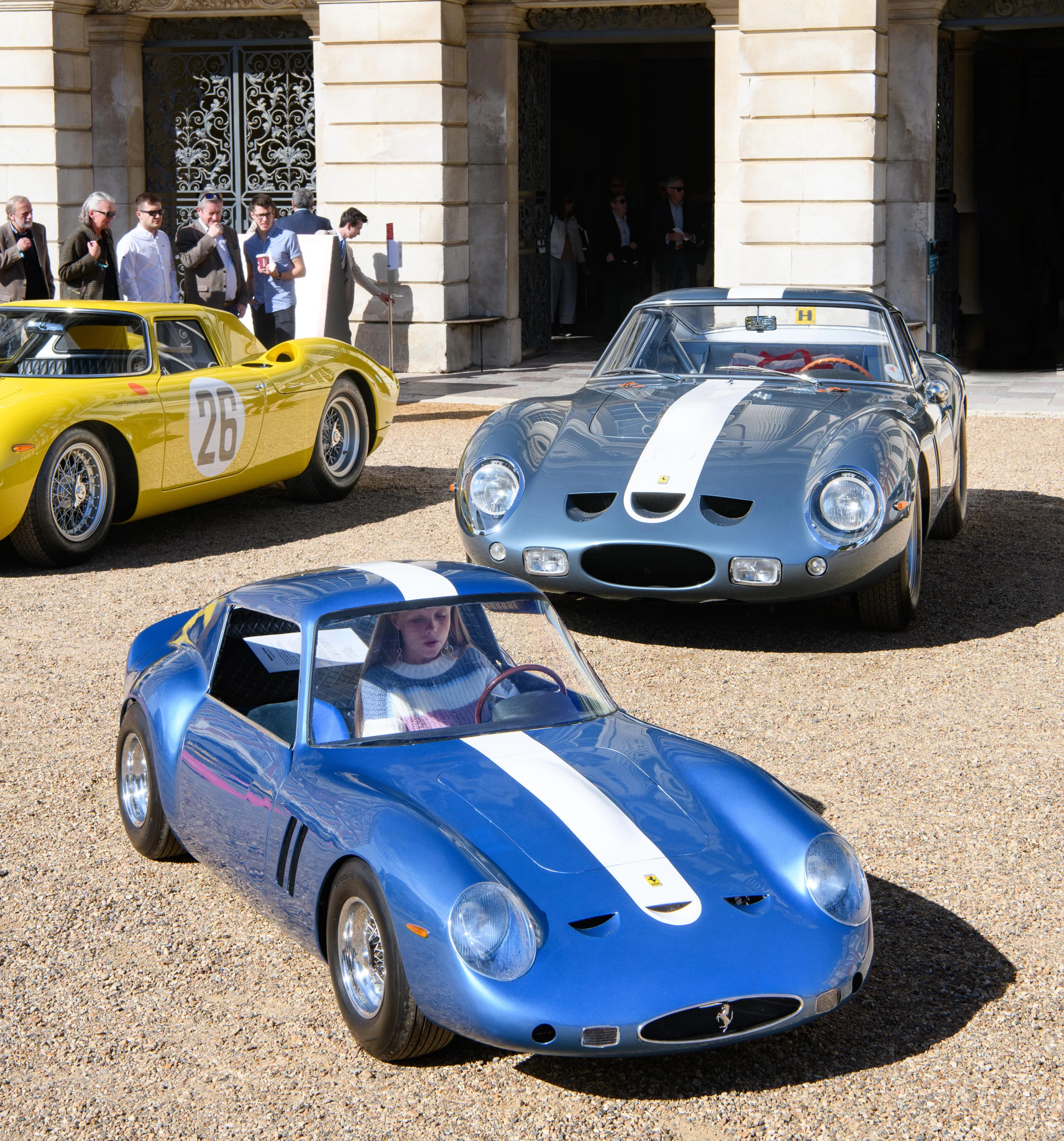 That’s Maddie and her Ferrari 250 GTO replica. The car is a copy of the 1962 GTO (chassis #3386) that finished sixth at Le Mans in 1962. That’s a hand-built alloy body over a stainless-steel chassis, powered by a water-cooled electric motor with lithium batteries. The car was built by dad so Maddie could participate in the 2020 Little Big Mans at Le Mans Classic. Sadly, the event was cancelled, but Maddie got to participate in the 2020 Junior Concours of Elegance.