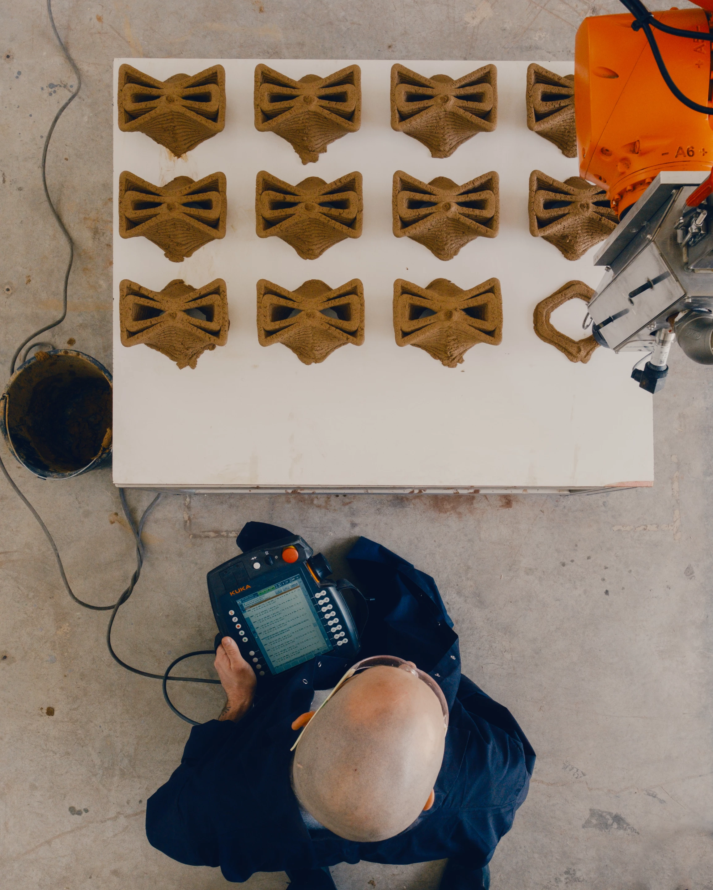 Robotic 3D printing meets ancient planting wisdom, shaping soil into shelter for young trees learning to survive their first seasons