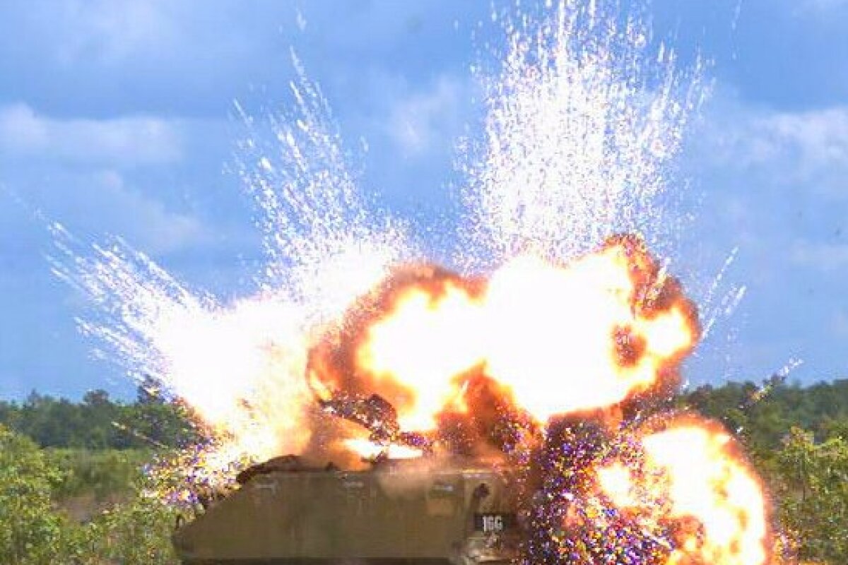 Detonation of a laser-guided warhead on an armored personnel carrier (Photo: Eglin AFB 780th Test Squadron)