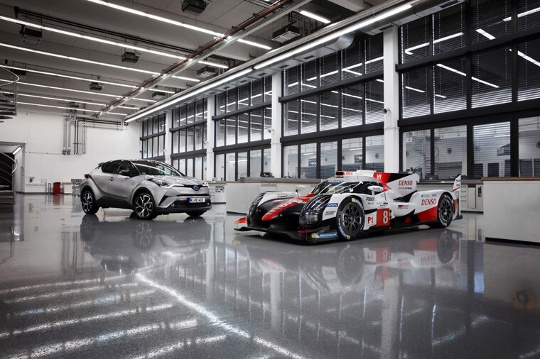 The TS050 alongside the Toyota C-HR