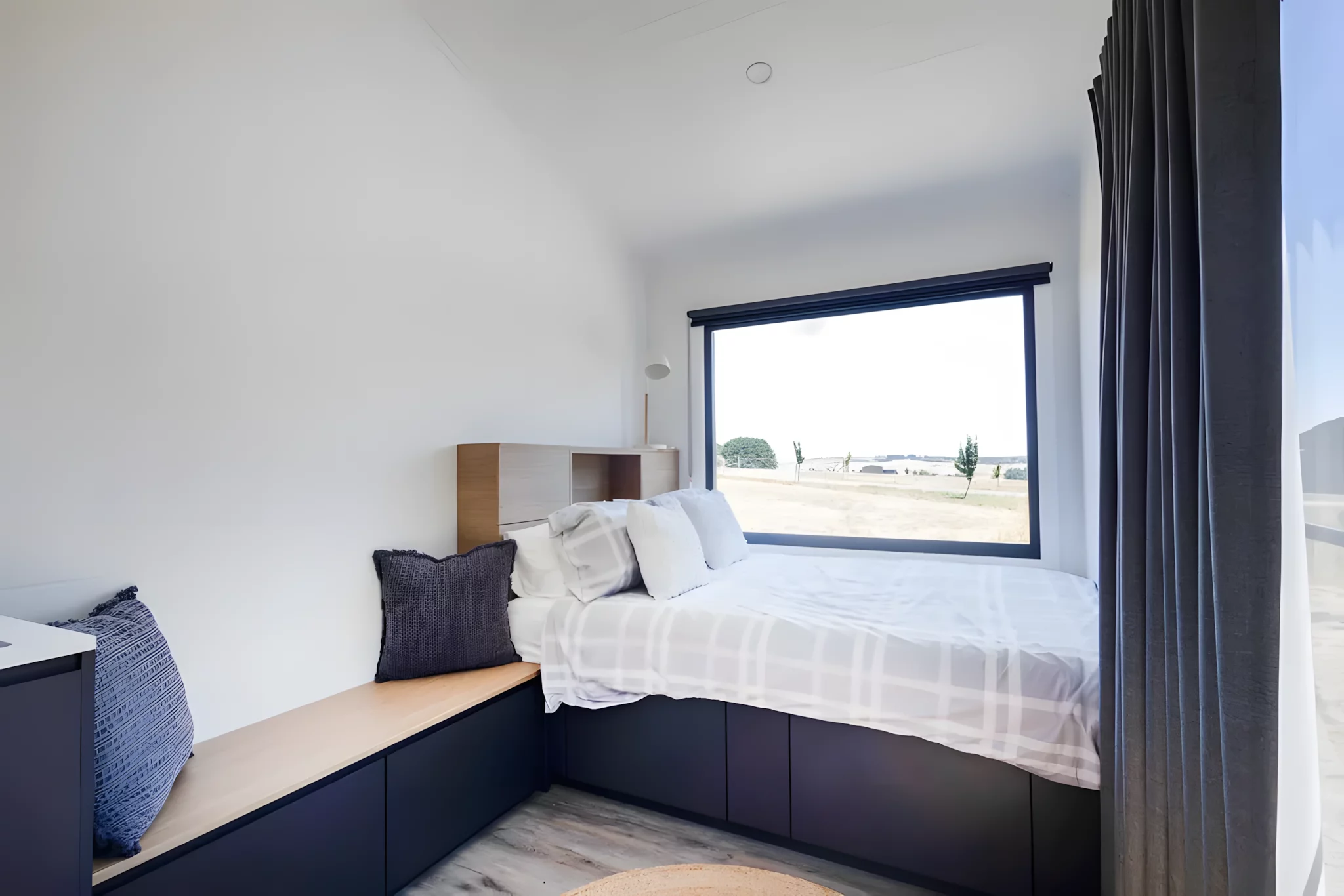 The Audrey's living area includes a bench-style seating area with integrated storage