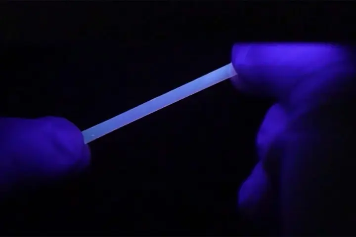 The polymer fluoresces under ultraviolet light, when stretched