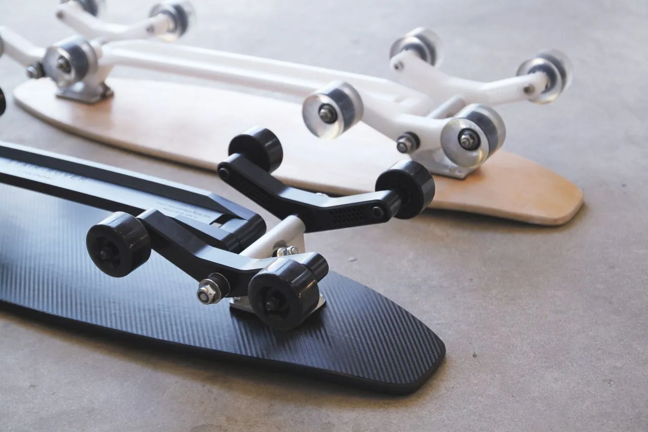 A minimum pledge of £235 (or US$360) will get backers a maple-decked basic model (top), while £270 ($415) will put them in line for the snazzy black fiberglass-decked Stair-Rover Pro
