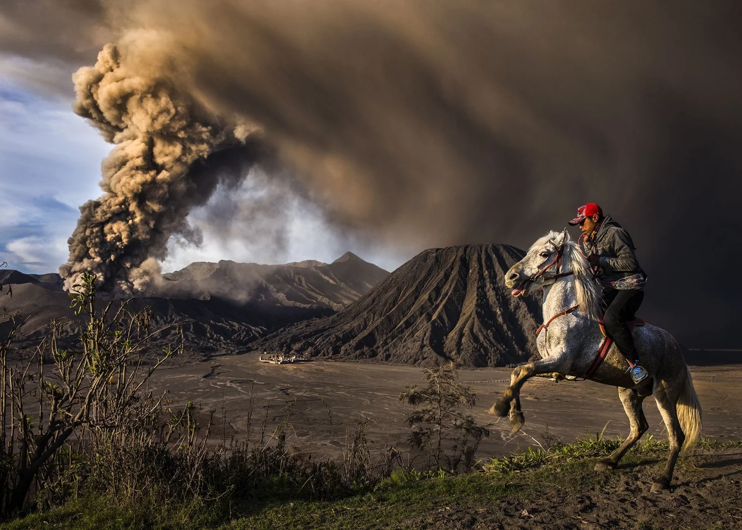 Second place in Journeys and Adventures category of the 2018 Siena International Photo Awards. The explosive eruption and loud rumbling of the Mt. Bromo volcano scared the horse causing it to rear up onto its hind legs