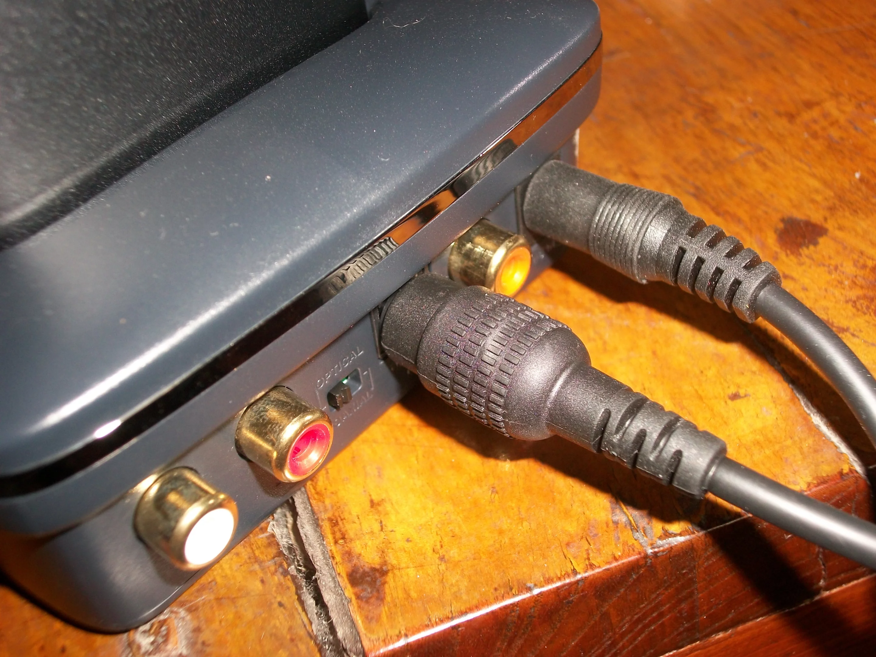 If choosing the optical cable to connect to a TV, the switch at the back must be moved to the appropriate position