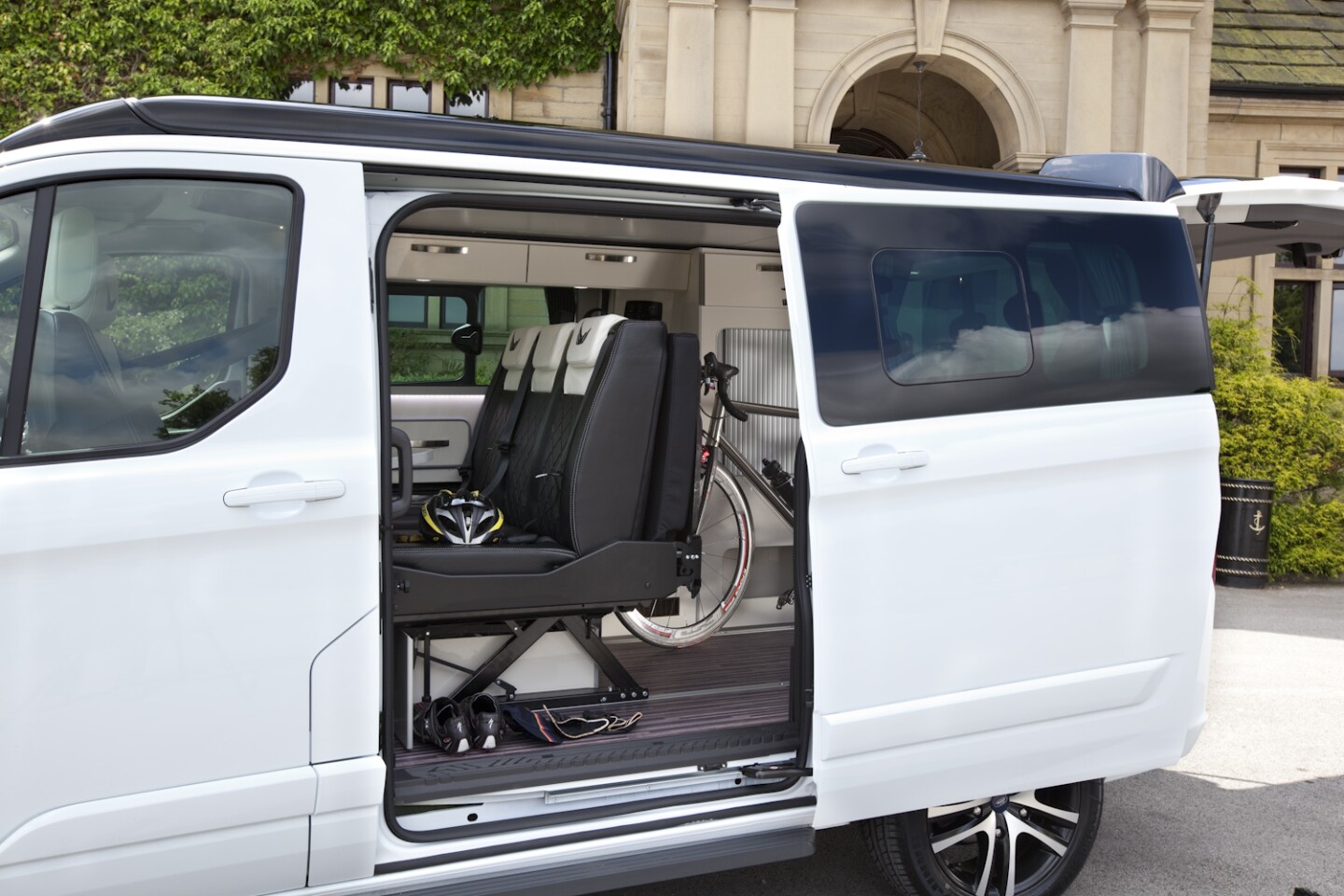 The sliding three-person bench is key to Wellhouse's combination of cargo hauling and camper comfort