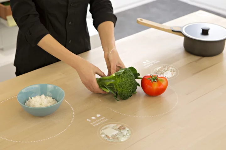 Placing food on the table of the Ikea Concept Kitchen 2025 calls up recommended dishes that use them