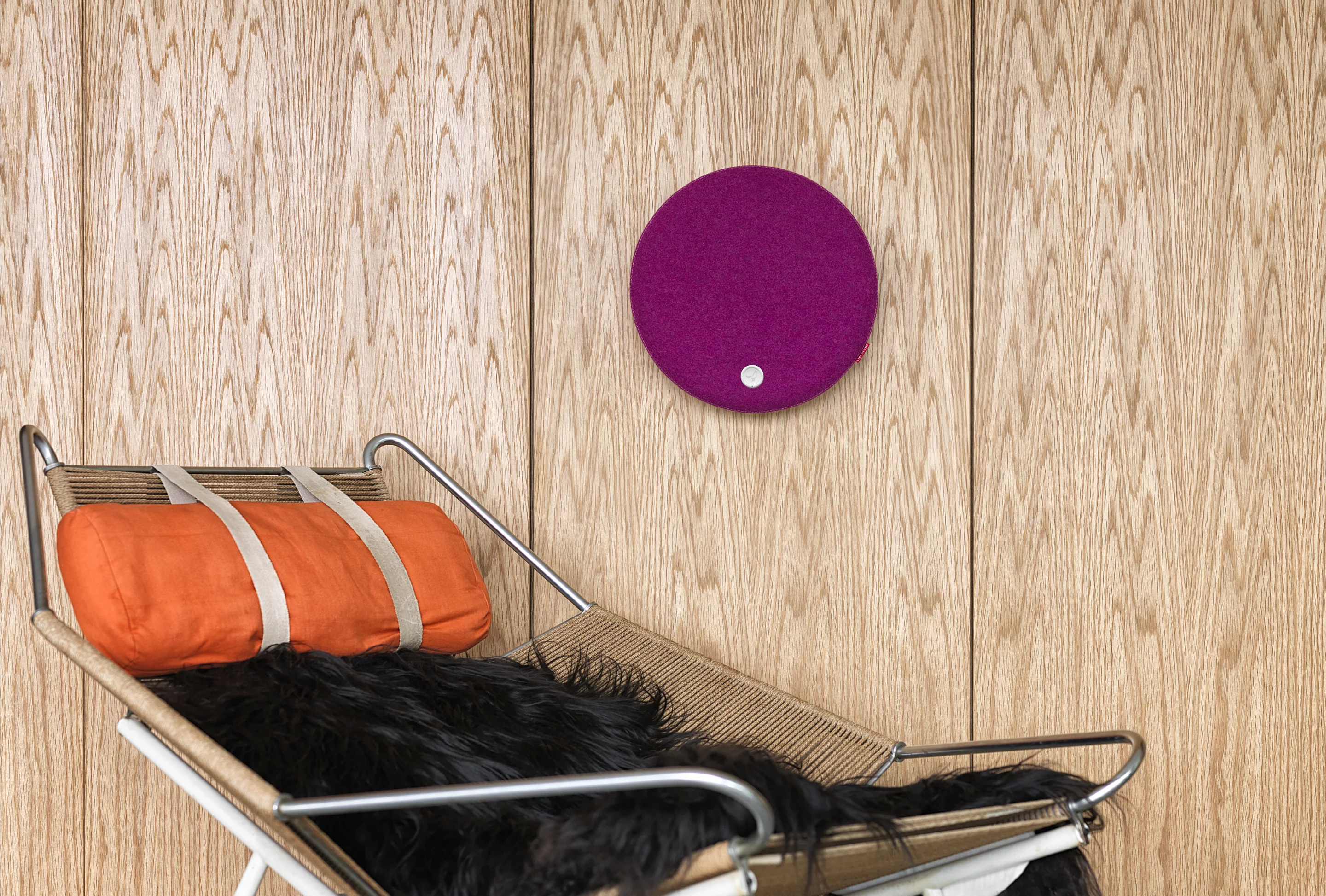 The 13.1-inch diameter Libratone Loop mounted on a wall