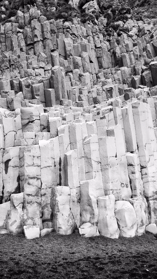 When lava cools and turns into basalt, it can crack along regular joints and make impressive columns such as those seen at the Giant's Causeway in Ireland or, to a lesser extend, here at the black sand beach in southern Icleand known as Reynisfjara.