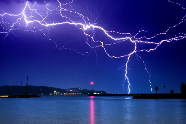 A new study has demonstrated how a tractor beam containing trapped graphene microparticles could one day redirect lightning strikes