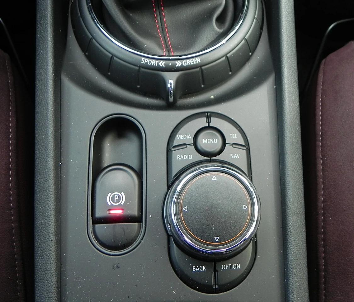 Like other BMW vehicles, the Mini’s dial-based controller has a touchpad on top and is located just forward of the center armrest for easy access