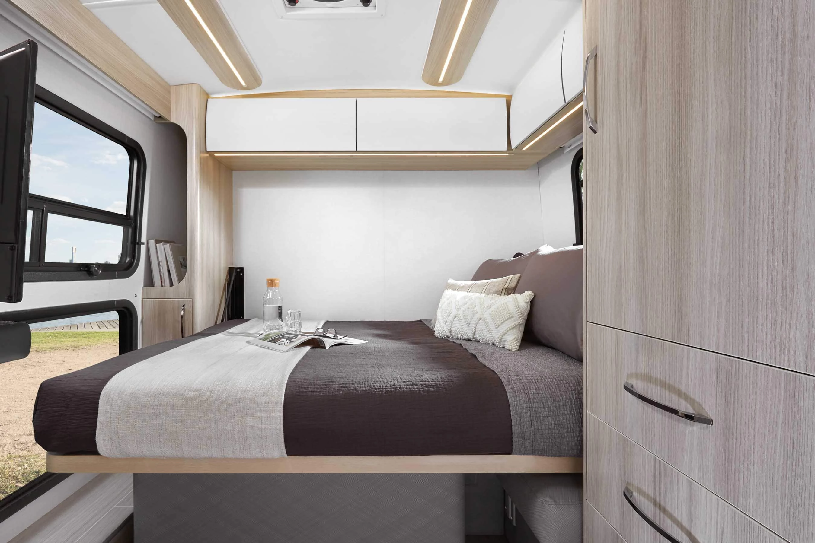 The double bed drops down from the rear wall at night, folds away during the day