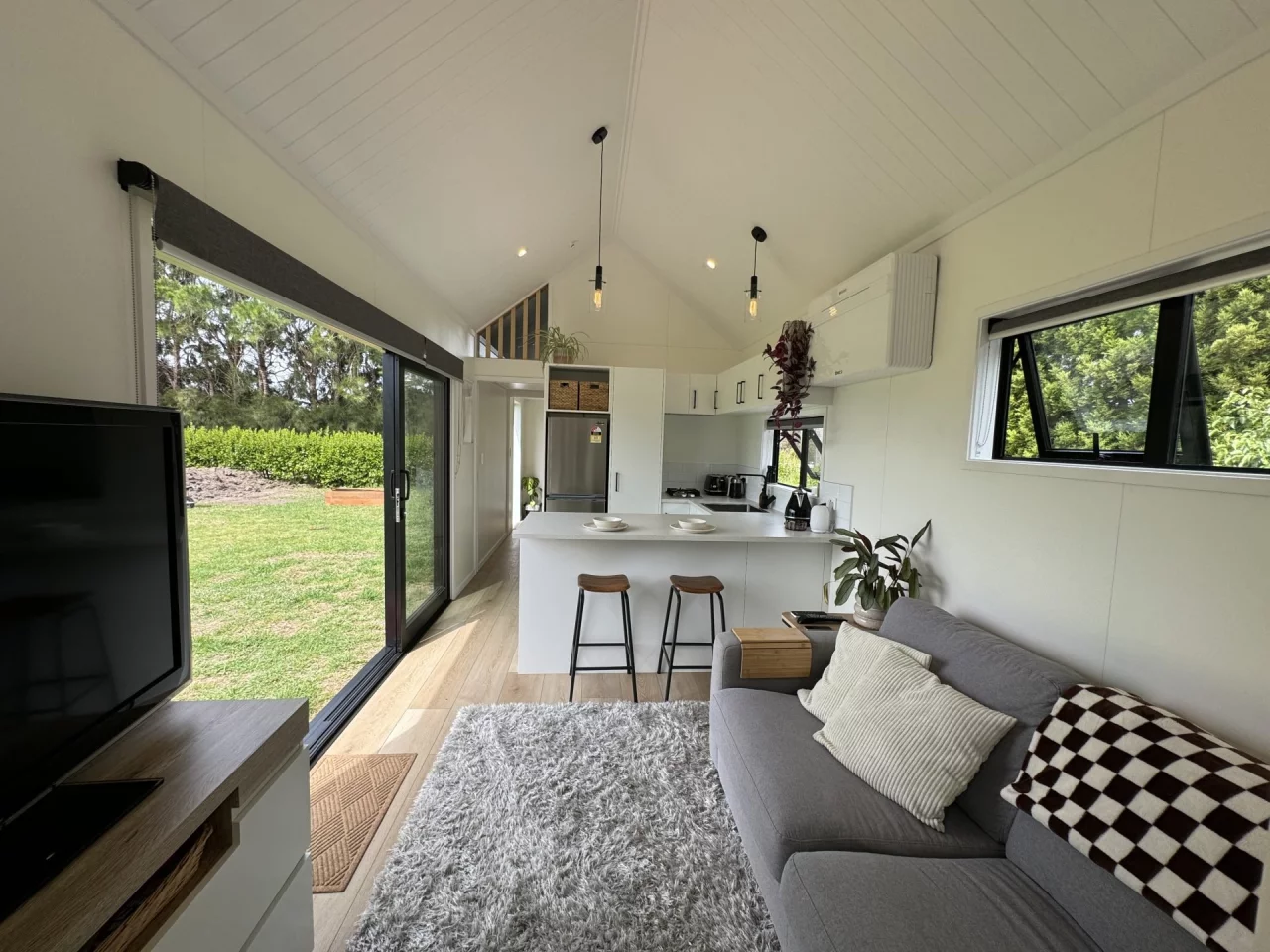 The kitchen in the Long Black (with loft) includes a breakfast bar seating area for two