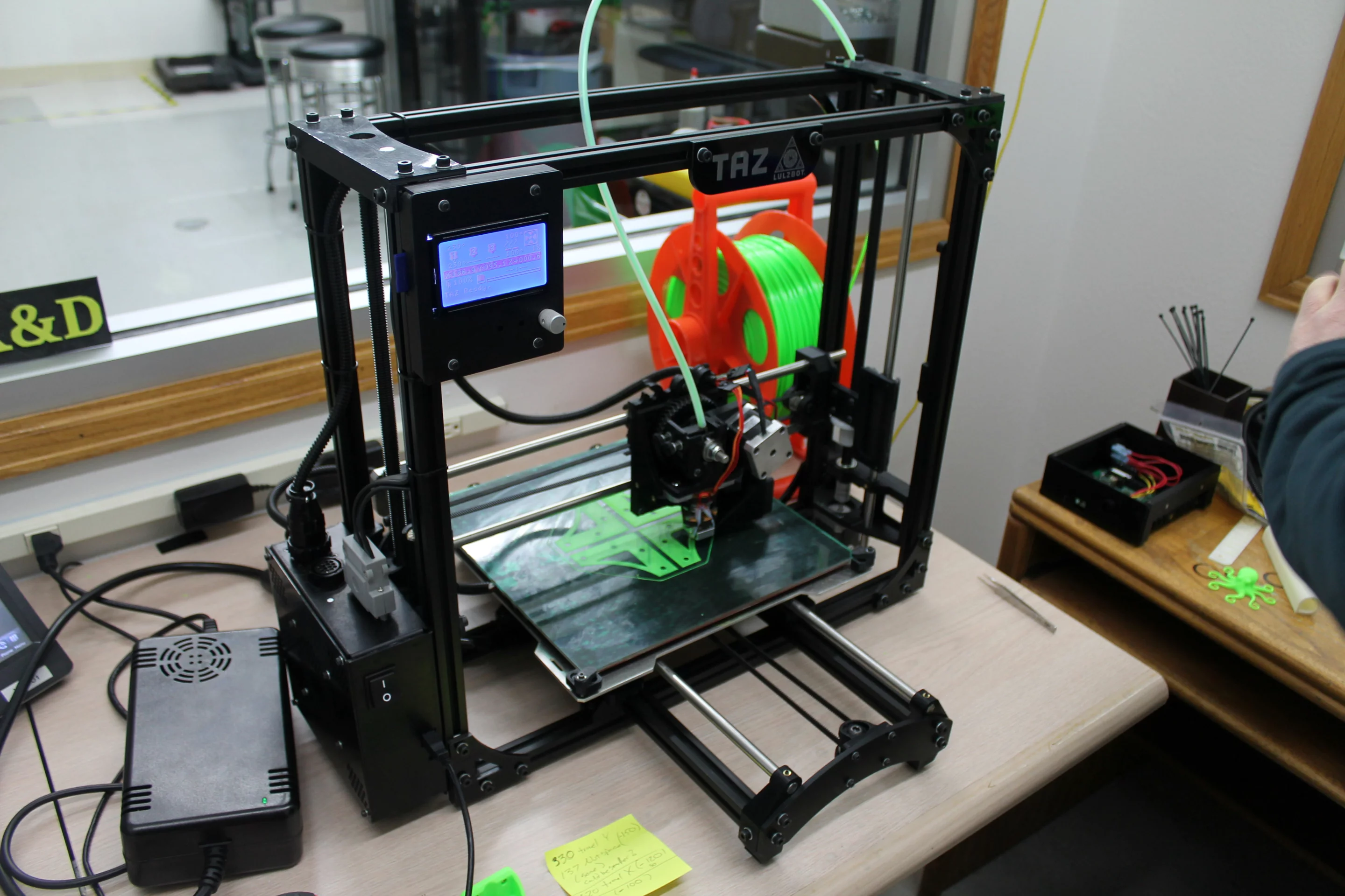 The current generation TAZ 3 3D printer at work in the R & D office