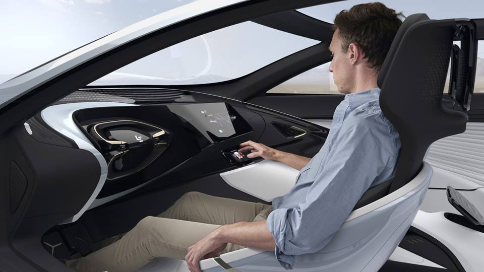 The interior includes a retractable steering wheel
