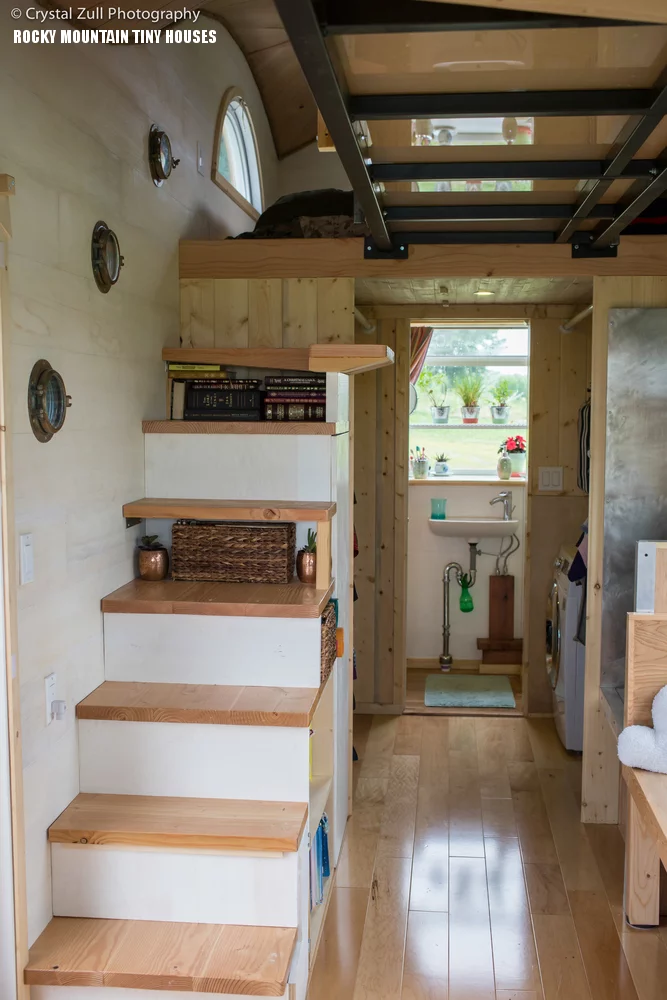 Two loft bedrooms are reached by the now ubiquitous tiny house stairs/storage combination
