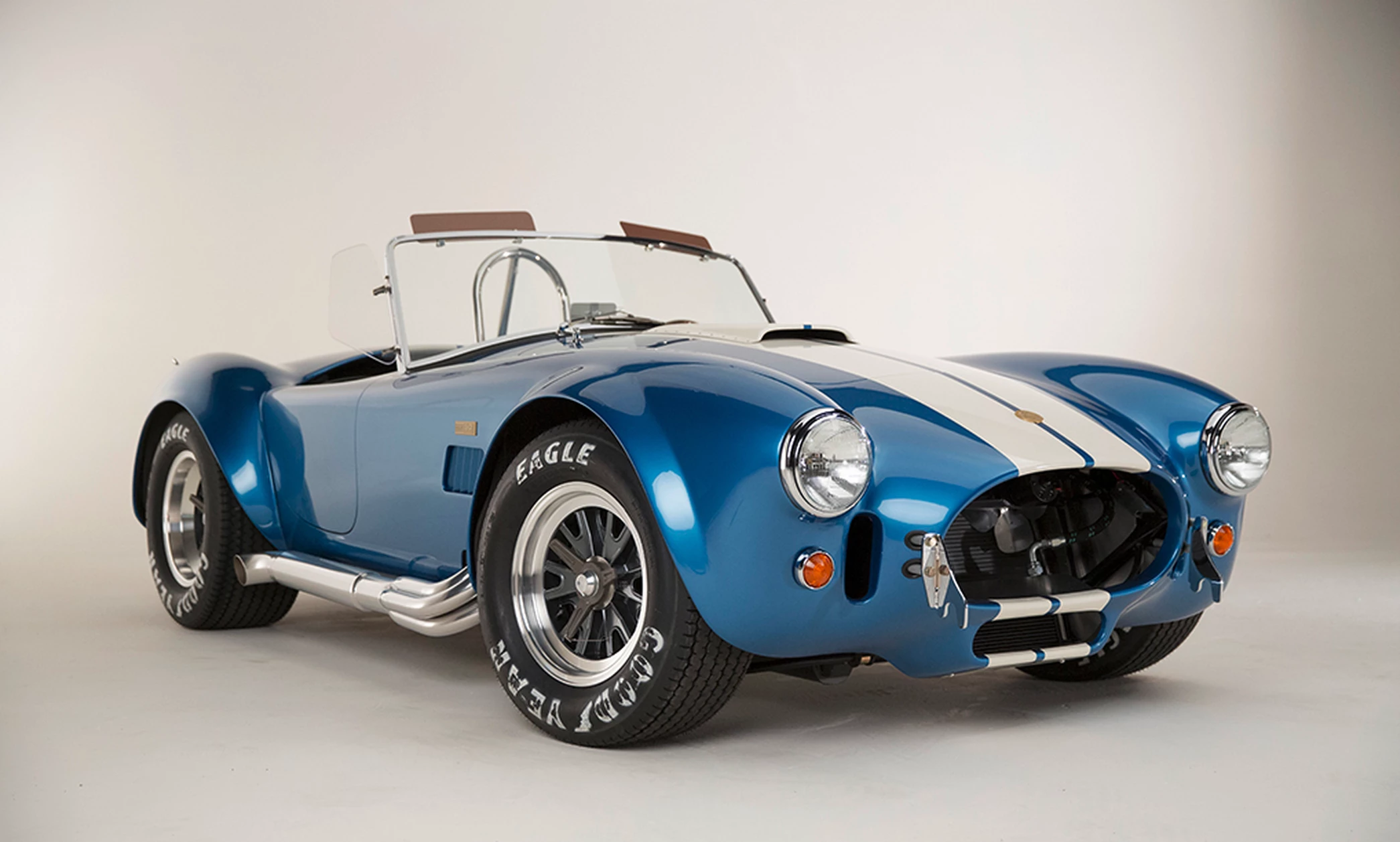 Each continuation Cobra will be painted Guardsman Blue with Wimbledon White stripes, equipped with a premium black leather interior and other special touches and the car will make it's public debut at the Barrett-Jackson Auction in Scottsdale, Arizona on January 12, 2015.