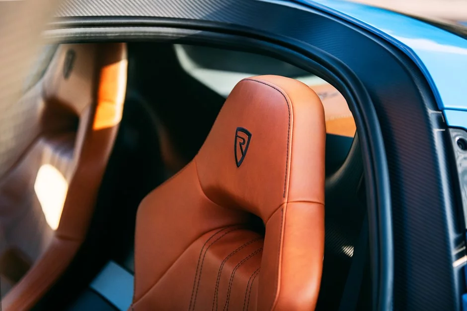 The blue exterior of the Rimac C_Two is offset by the saddle brown interior, a beautiful contrast