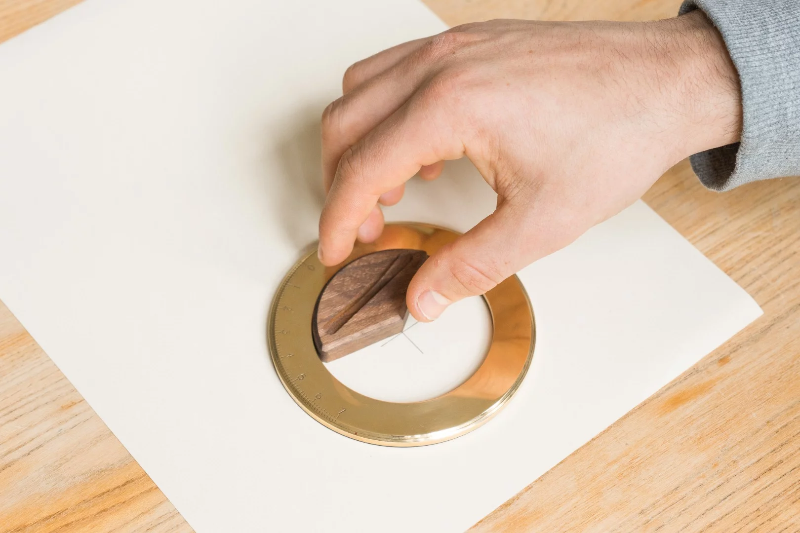 The wooden base of the Iris doubles as a tool for locating the center of your circle