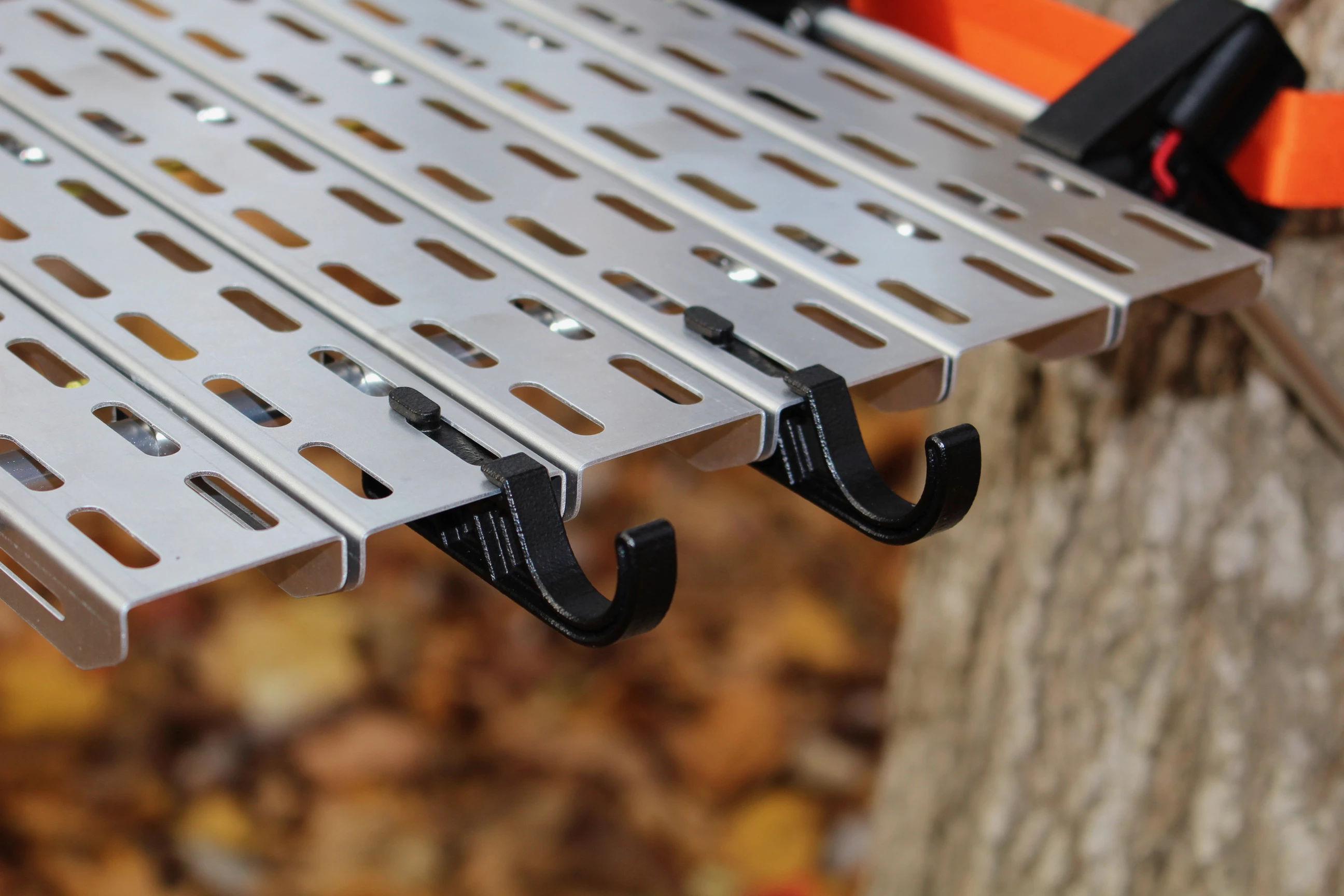 Slots in the table allow for the mounting of accessories such as the Gear Hooks