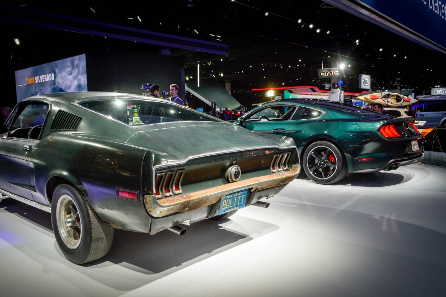 The 1968 Ford Mustang GT 390 from the movie Bullitt next to Ford's new Mustang Bullitt