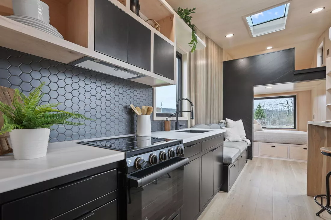 The Sangja's kitchen includes an oven with a propane-powered stove, fridge/freezer, and sink