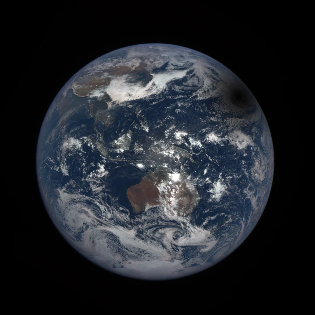 The shadow of a total solar eclipse crossing over the Earth in 2016