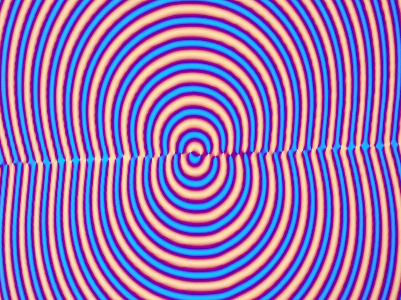 The concentric circles of the geometric phase hologram, as seen through a polarizing optical microscope (Image: ImagineOptix Corporation)