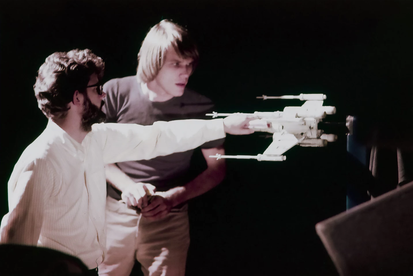 George Lucas discussing this model miniature with an ILM Techie during the shooting of the very first Star Wars movie. The possibility that it would one day sell for more than $3 million was not a possibility. In all the modeling of production costs and ROI for financiers of movies, no doubt there are a few more revenue streams that have been added to the balance sheet since then.