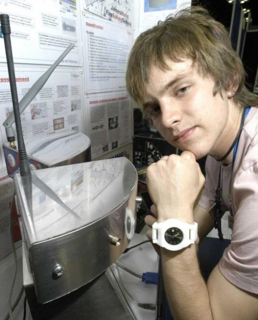 James Malin, 17, from Leicestershire, in the United Kingdom, with His Project, a "Proximity Fire Alarm," which uses RF10 technology to transmit the location of individuals in a building during a fire emergency.