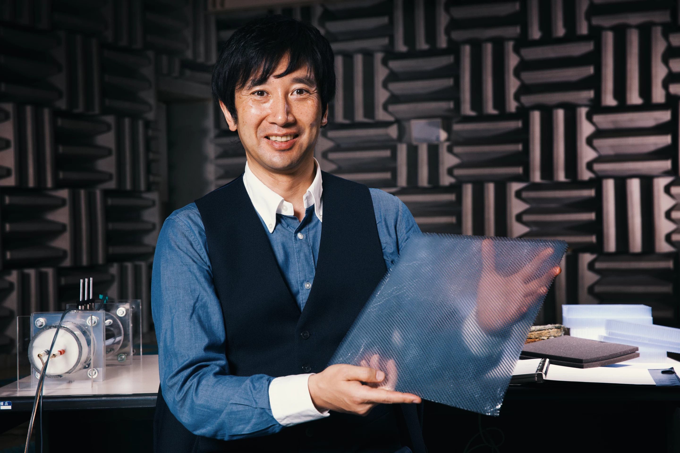Advanced Materials Engineer Susumu Miura with the acoustic meta-material