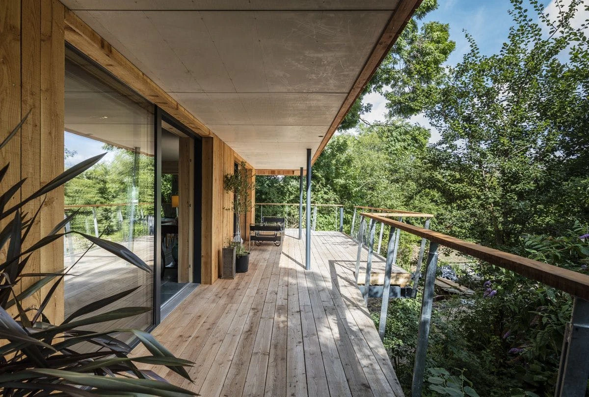 Dursley Treehouse features a lightweight balcony that encircles the entire home