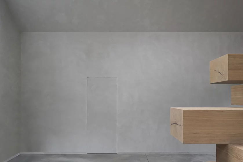 To create an office space, the firm added a novel structure comprising 12 layers of timber beams, stacked, Jenga-like into a complex structure