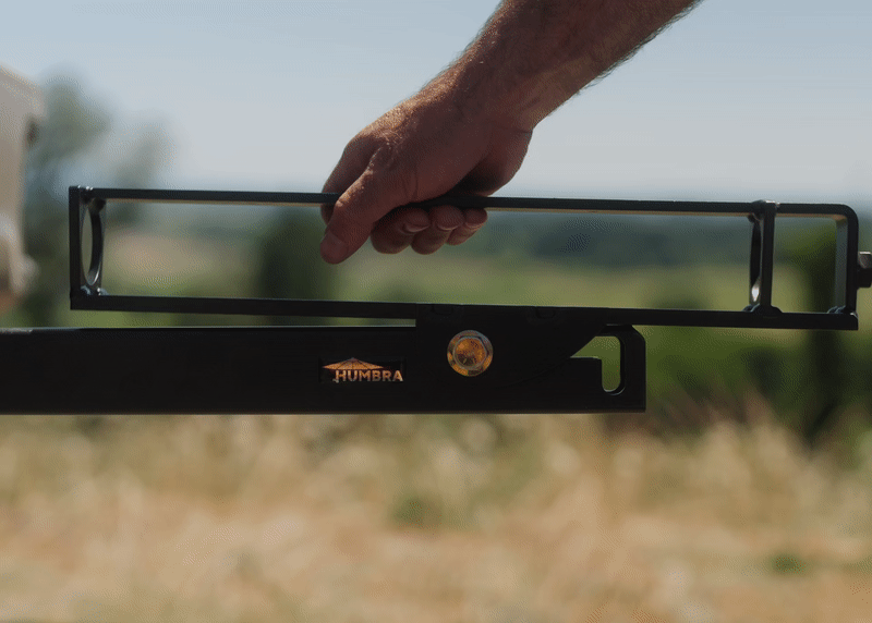 The pivoting umbrella holder mounts to the vehicle's 2-in hitch receiver to offer an alternative vehicle awning style