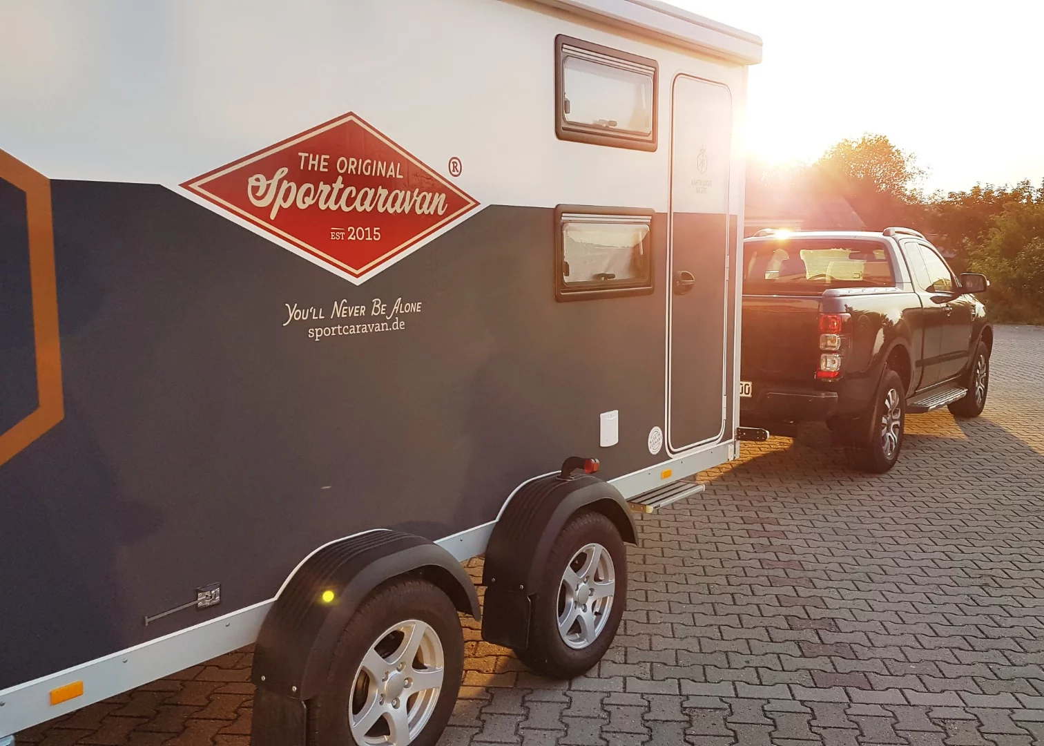 The dual-axle Sportcaravan Cube carries toys and provides shelter