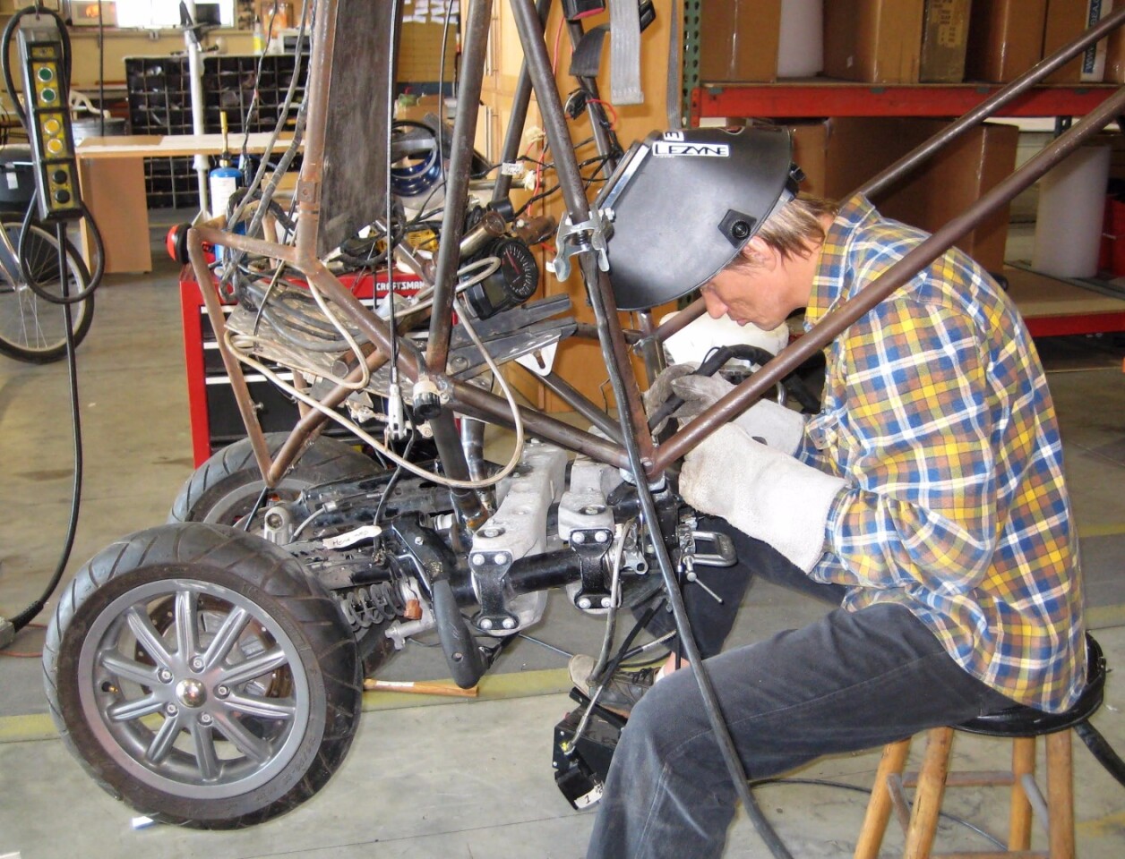 Dezso Molnar works on attaching the Piaggio MP3 front end to version 3 of the G2 Gyrocycle