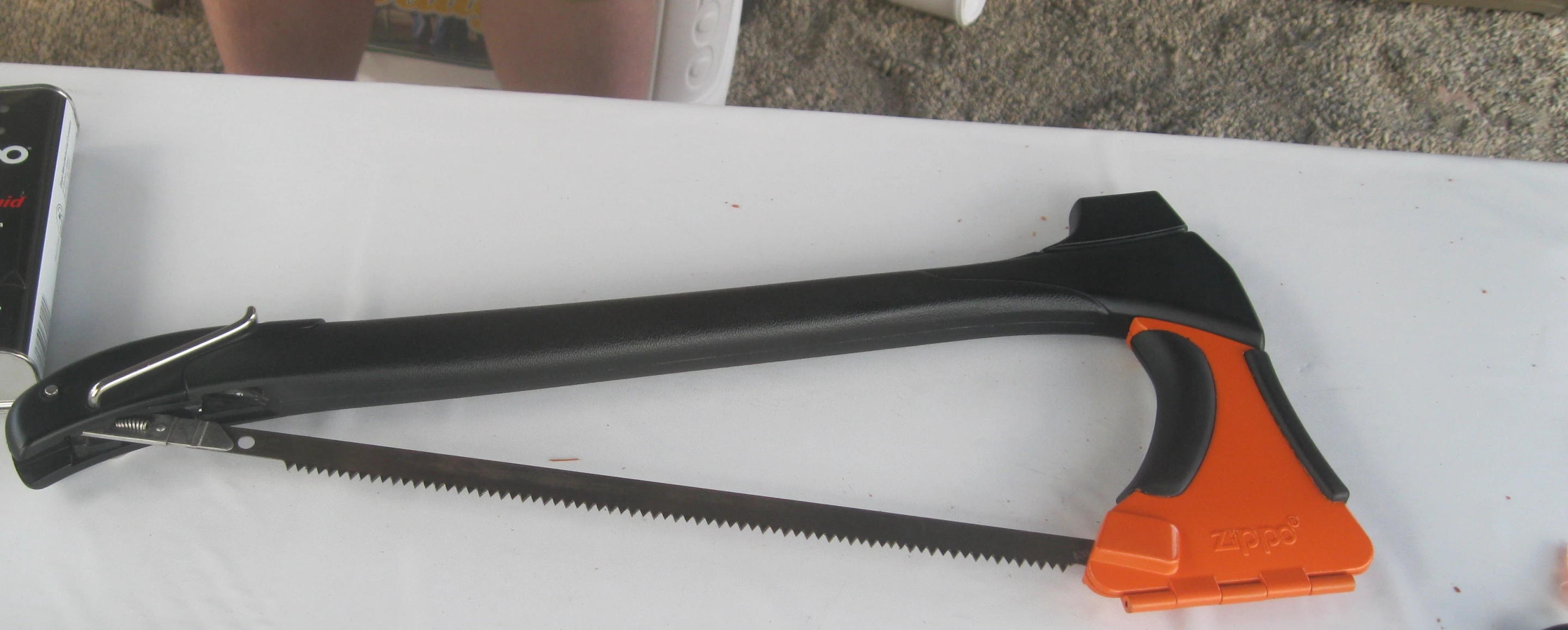 The blade is held in place by a locking cam and tension compensator