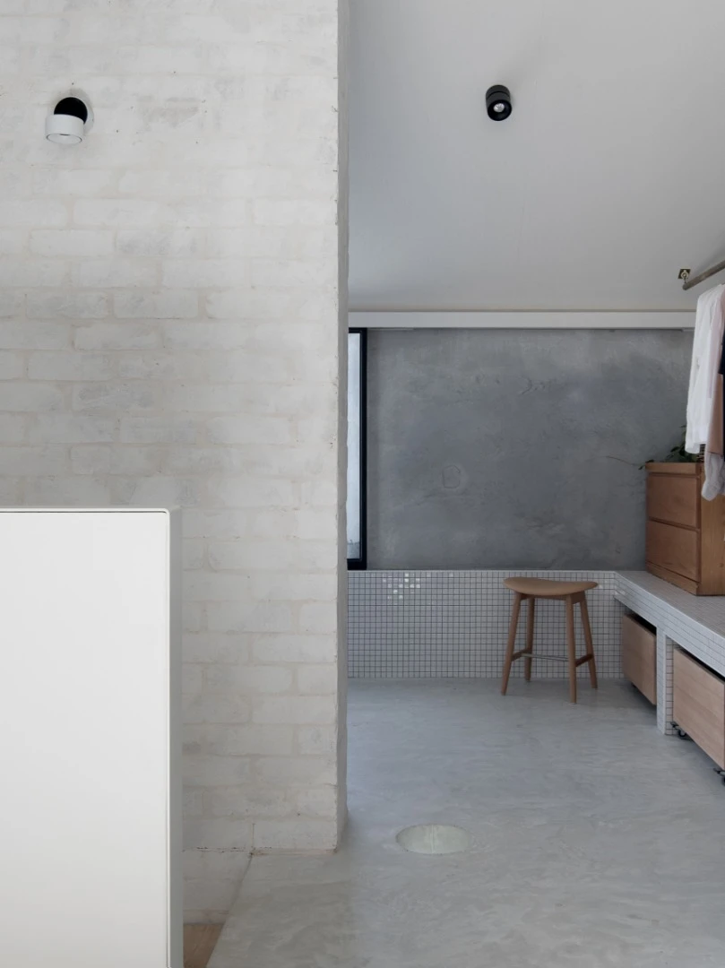 The upstairs master bathroom is private without the needs for walls or doors
