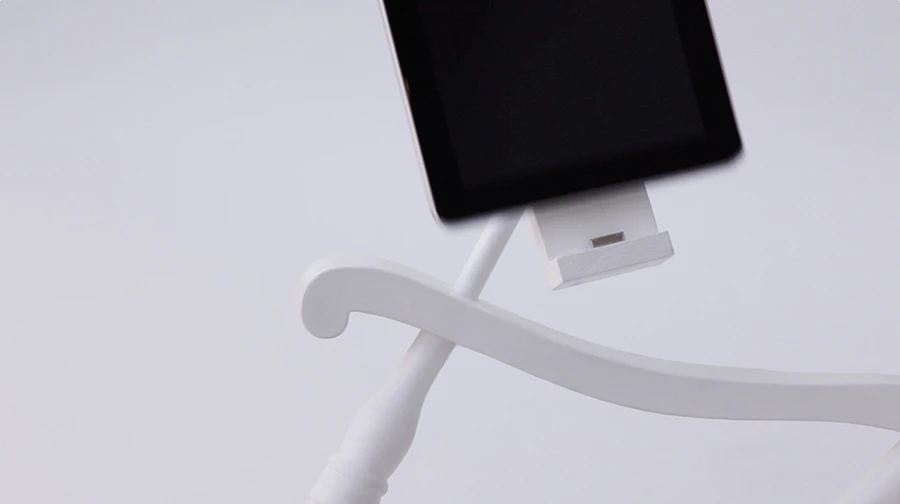 The iRock Rocking Chair connects to iDevices via a 30-pin dock connector