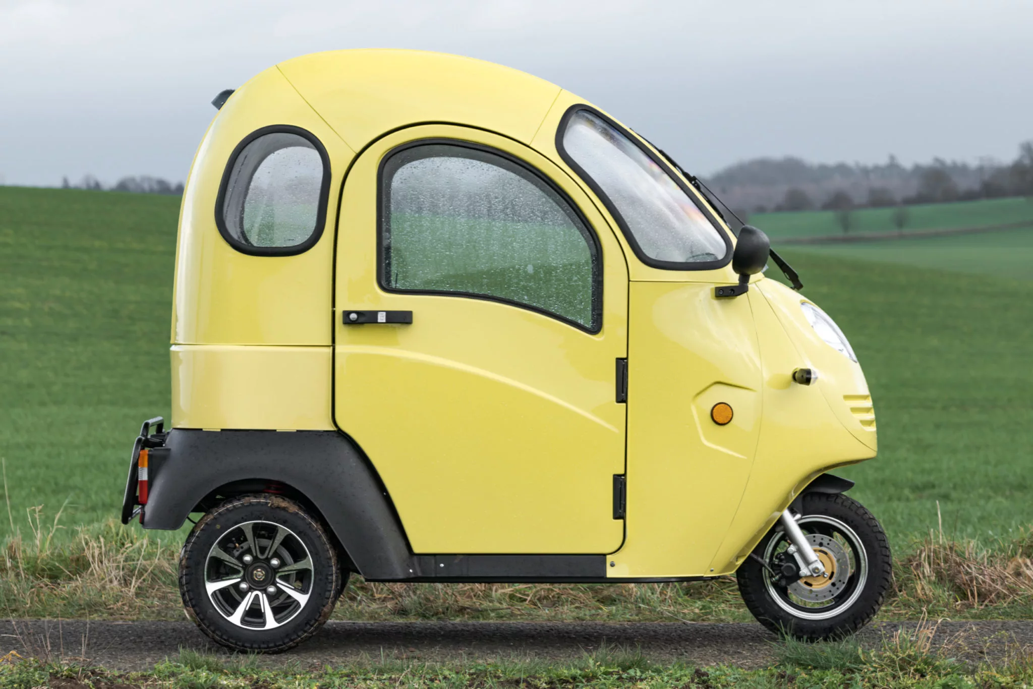 The three-wheeled car has a tiny range of 25 miles (40 km)