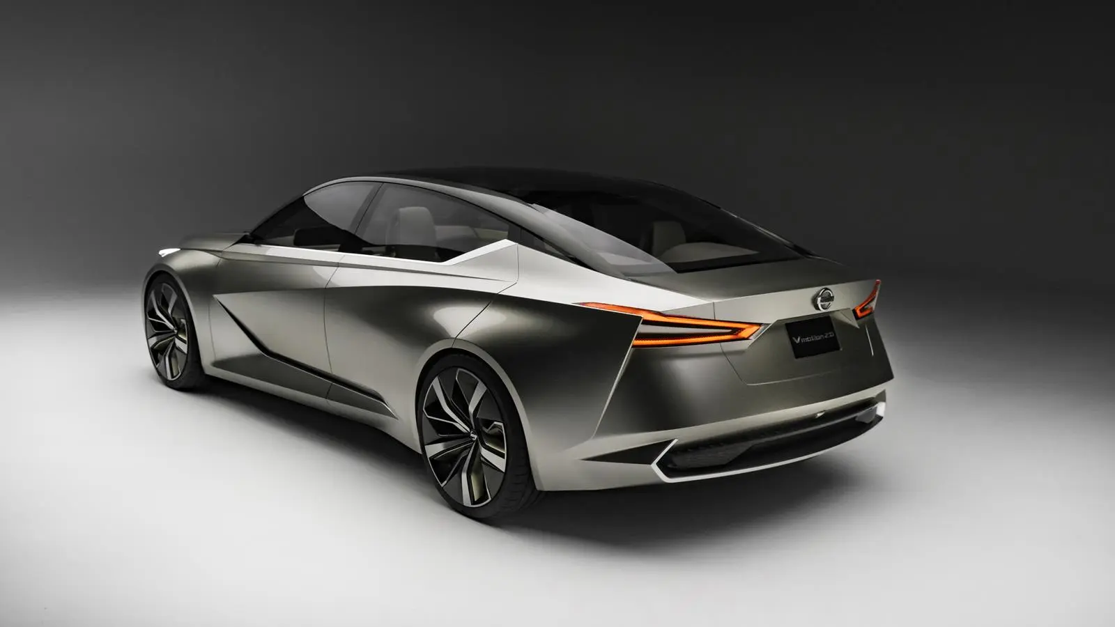 The aggressive departure angle of the lower rear fascia showcases the wide tires that propel the Vmotion 2.0