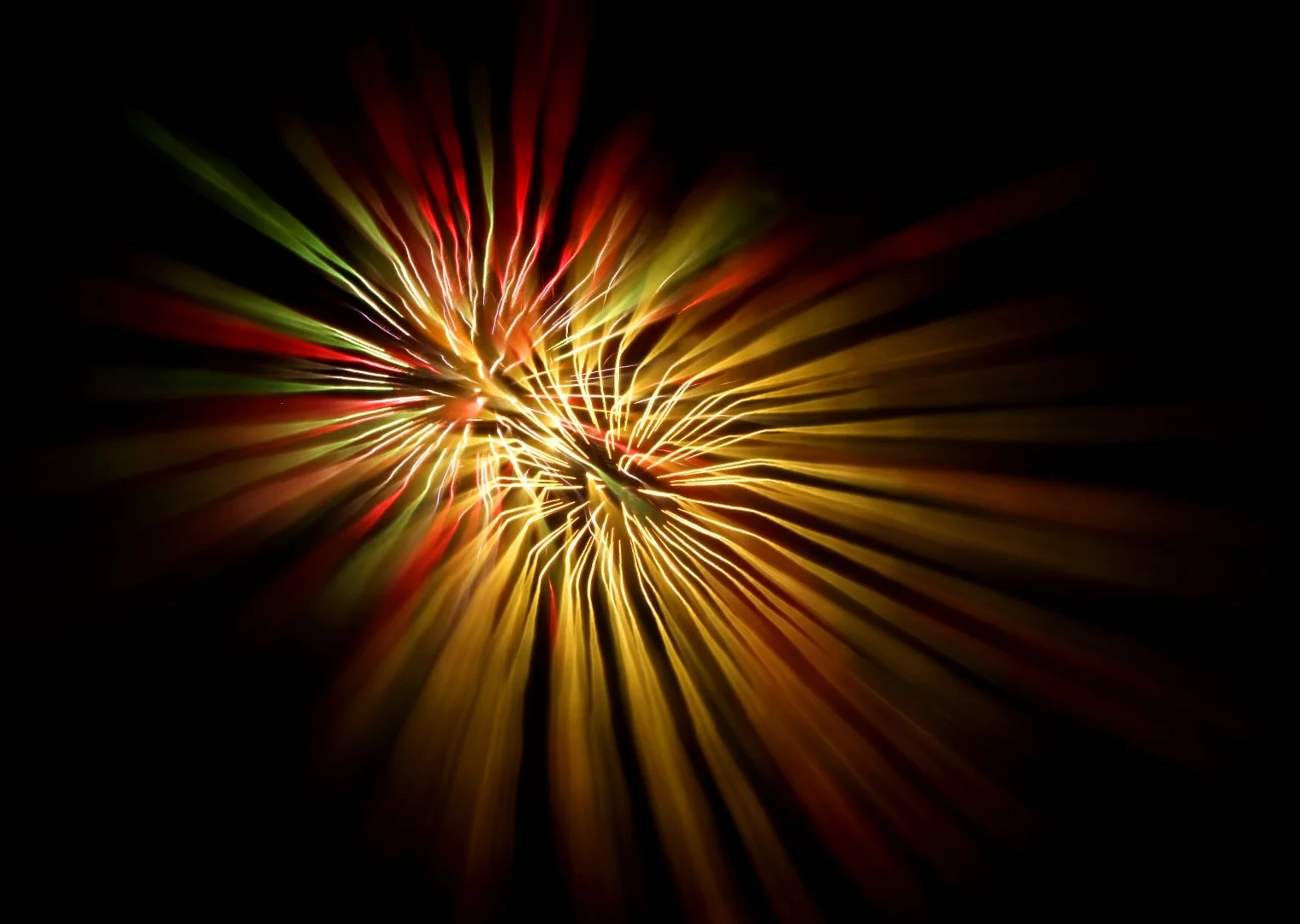 Starting the shot with perfect focus, then rotating the ring out of focus through the exposure gives you sharp starting points that bleed out into soft ending trails