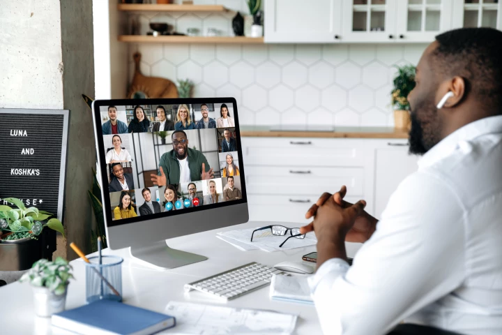 Want to appear more competent? Smile and tidy up that background the next time you're on a video call, says a team of UK researchers