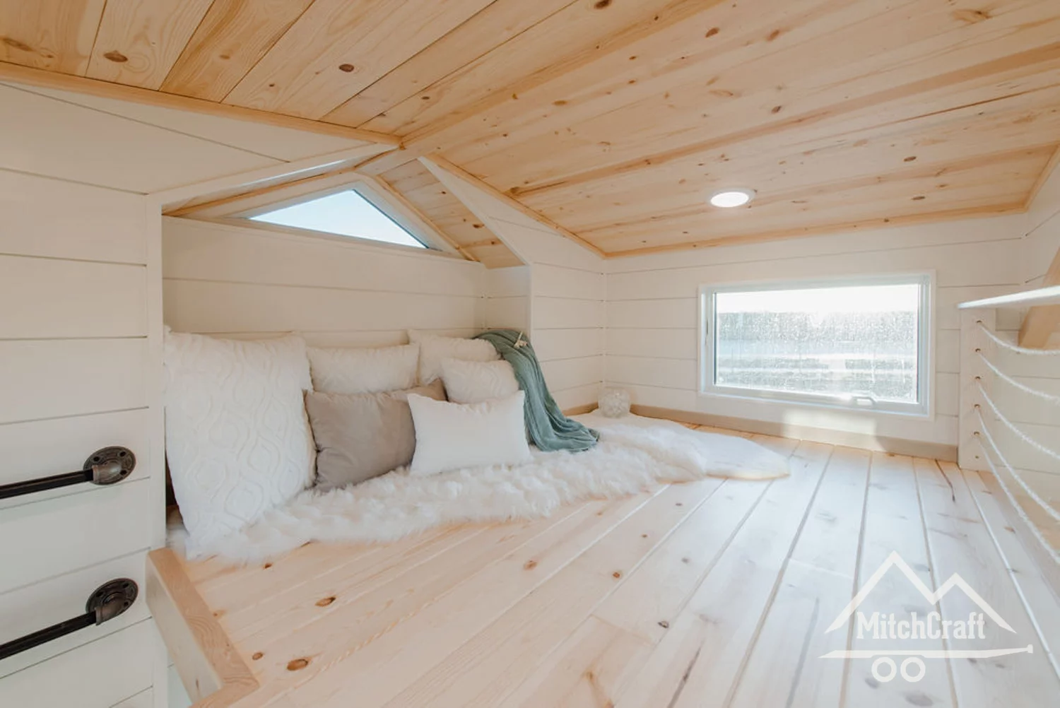 The second loft space can be used as a retreat or extra sleeping quarters for guests