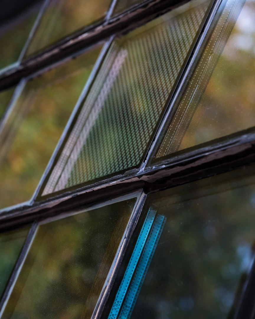 The Up-Cycle House's unusual windows were made using glazing samples and waste from other projects